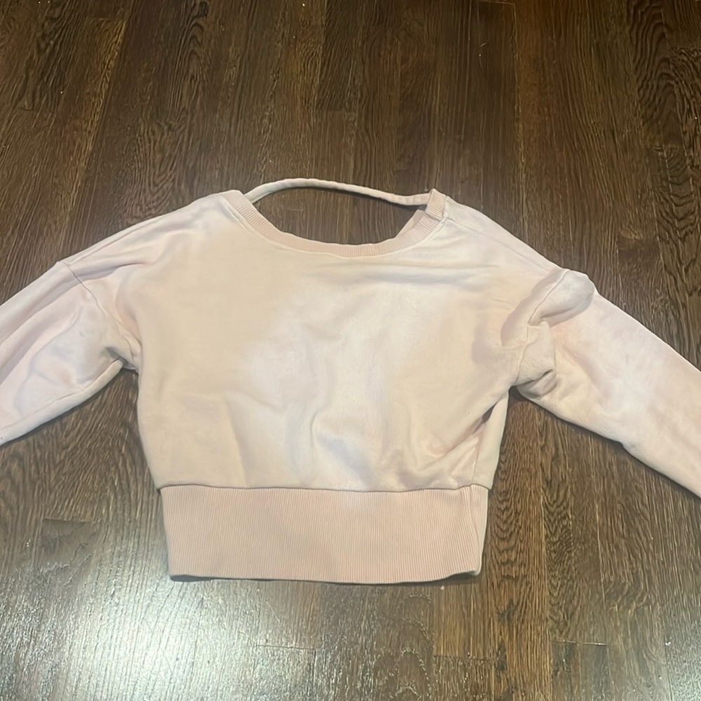 light pink open-backed sweatshirt